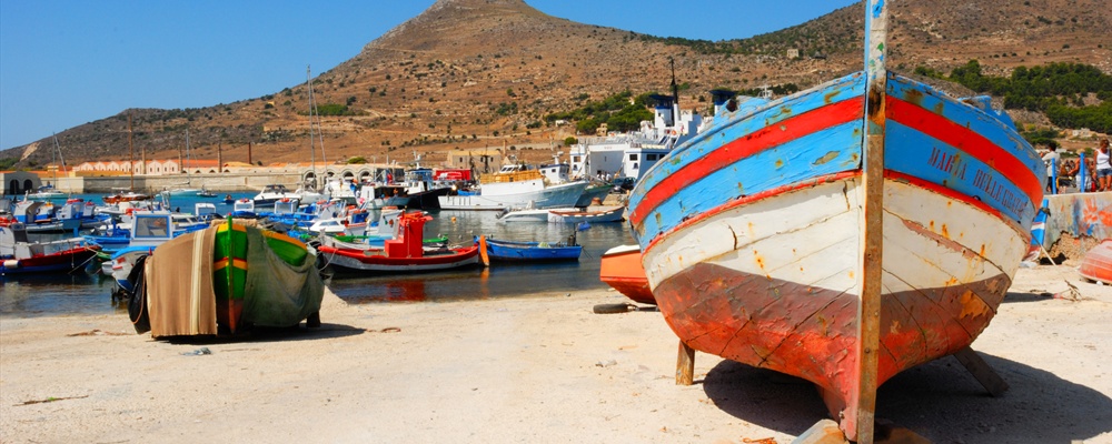 Favignana - A colorful boat at the harbour